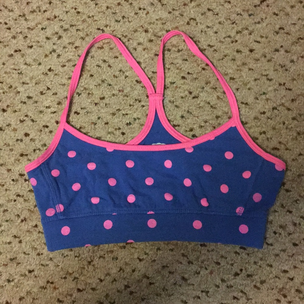 Pink polka dotted blue sports bra